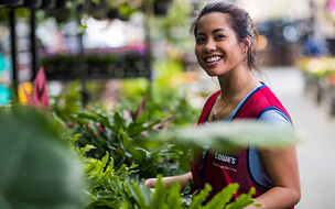 Female Lowes associate in plant department 