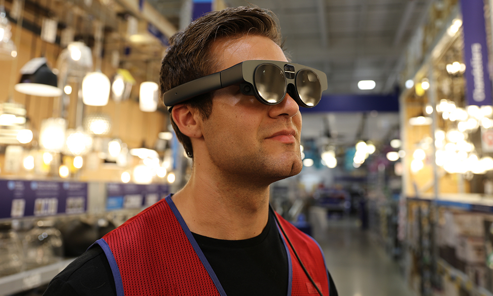 Closeup view of Lowes Home Improvement store associate wearing an AR headset used to assist in visualizing the Store Digital Twin in realtime.